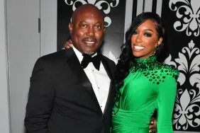 Porsha Williams in a green dress posing with Simon Guobadia