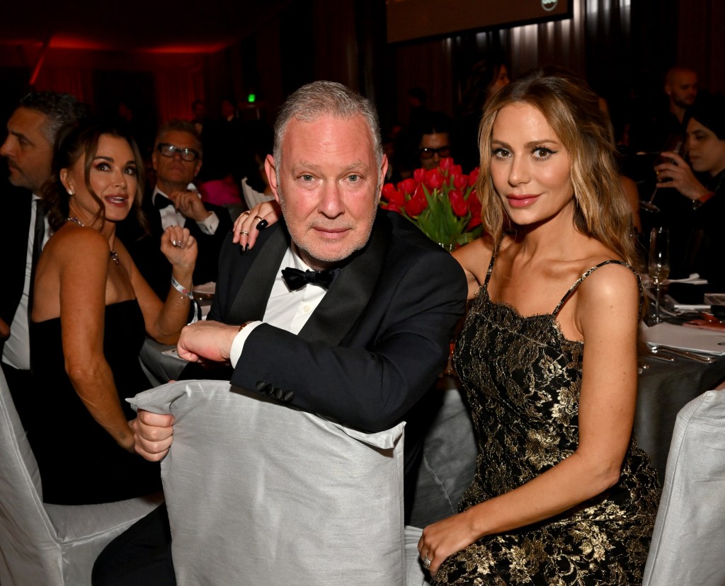 Dorit Kemsley and Paul Kemsley sitting at a table at a formal event