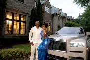 Shamea Morton and her husband posing in front of a Rolls Royce
