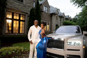 Shamea Morton and her husband posing in front of a Rolls Royce