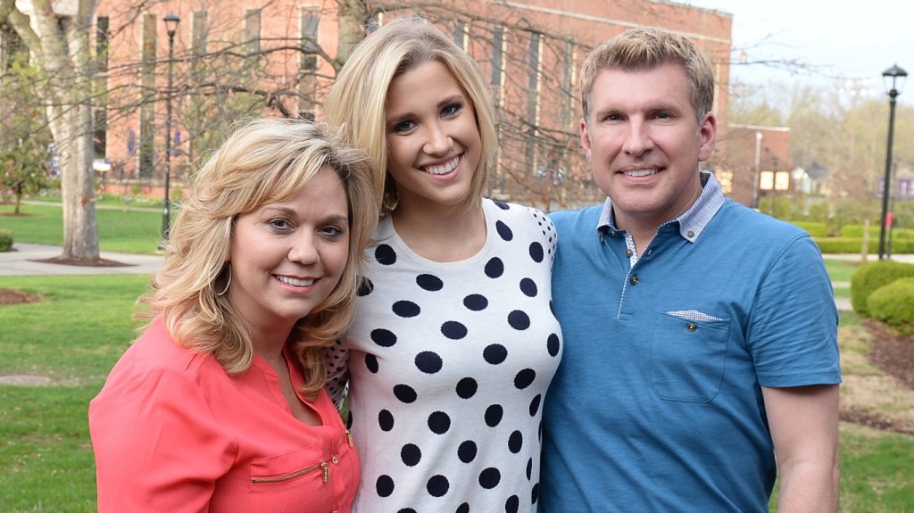 Savannah Chrisley, Todd Chrisley, and Julie Chrisley posing together