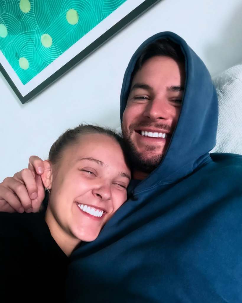 JoJo Siwa and Chris Hughes cuddling