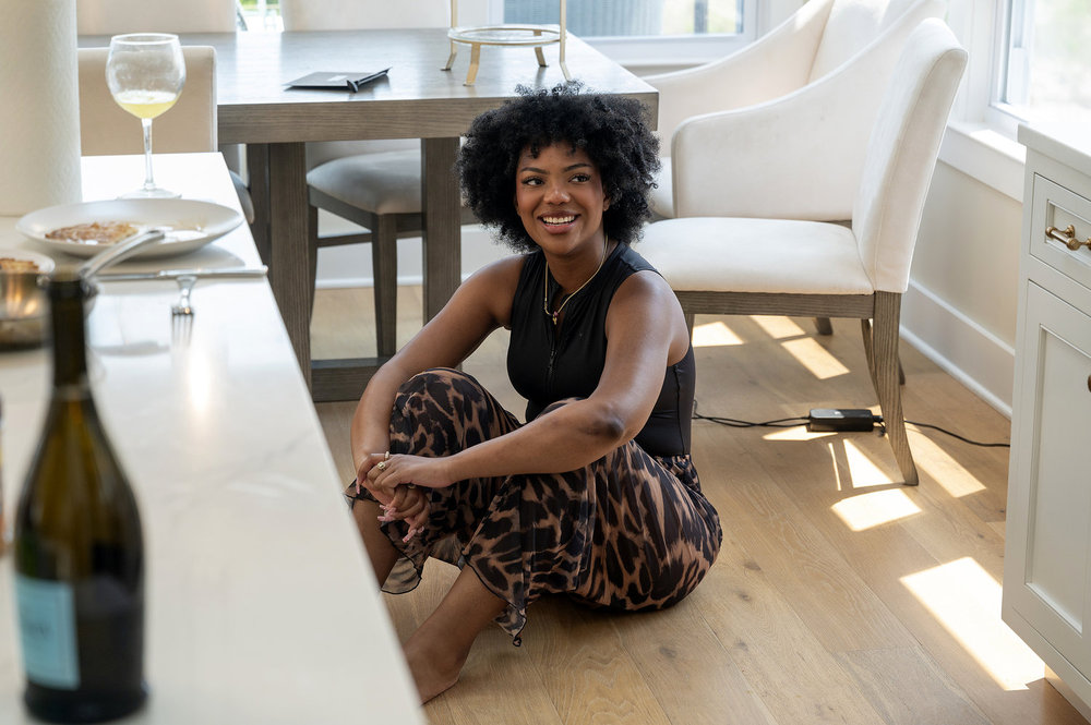 Riley Burruss sitting on the floor of an apartment on Next Gen NYC