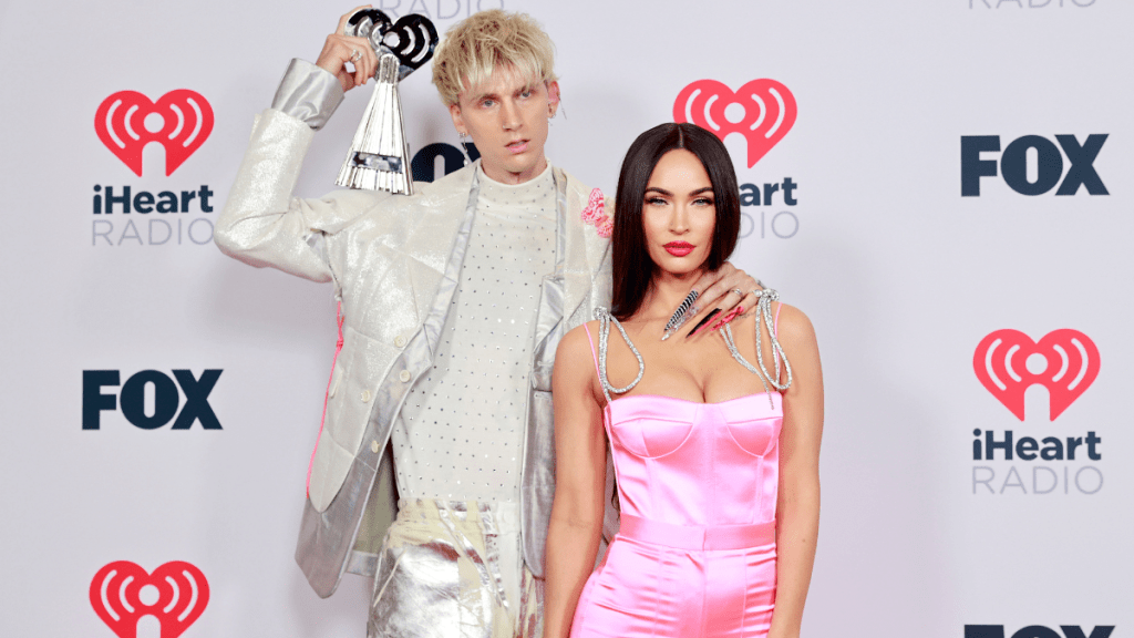 Machine Gun Kelly, winner of the Alternative Rock Album of the Year award for 'Tickets To My Downfall,’ and Megan Fox attend the 2021 iHeartRadio Music Awards at The Dolby Theatre in Los Angeles, California, which was broadcast live on FOX on May 27, 2021.