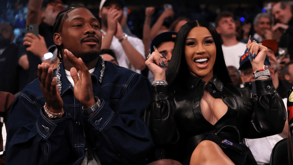 (L-R) NFL Player Stefon Diggs and rapper Cardi B sits court-side during the first quarter in Game Four of the Eastern Conference Second Round NBA Playoffs between the Boston Celtics and the New York Knicks at Madison Square Garden on May 12, 2025 in New York City.
