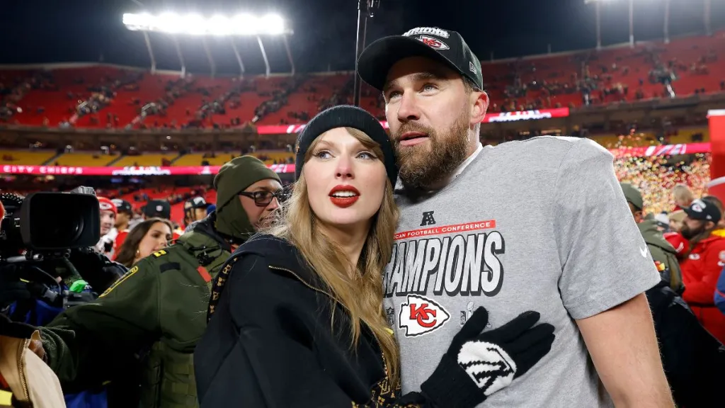Taylor Swift celebrates with Travis Kelce #87 of the Kansas City Chiefs after defeating the Buffalo Bills 32-29 in the AFC Championship Game at GEHA Field at Arrowhead Stadium on January 26, 2025 in Kansas City, Missouri.