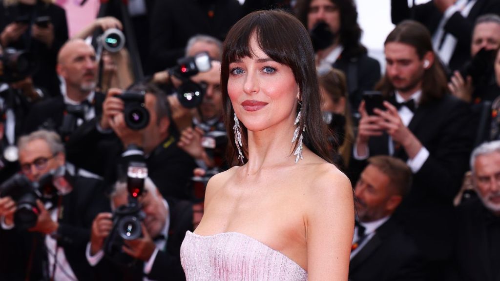 Dakota Johnson attends the "Highest 2 Lowest" red carpet at the 78th annual Cannes Film Festival at Palais des Festivals on May 19, 2025 in Cannes, France.