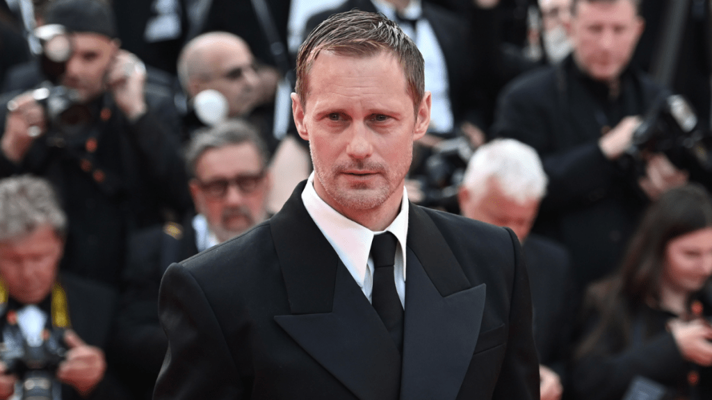 Alexander Skarsgård walks the red carpet at the premiere of the film "The Phoenician Scheme" at the 78th Cannes International Film Festival.