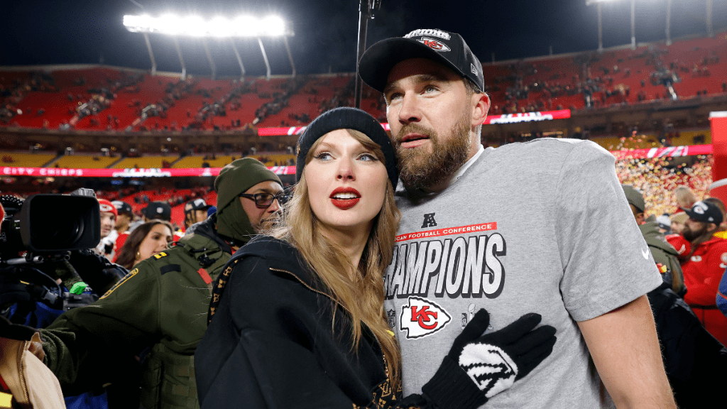 Taylor Swift celebrates with Travis Kelce #87 of the Kansas City Chiefs after defeating the Buffalo Bills 32-29 in the AFC Championship Game at GEHA Field at Arrowhead Stadium on January 26, 2025 in Kansas City, Missouri.