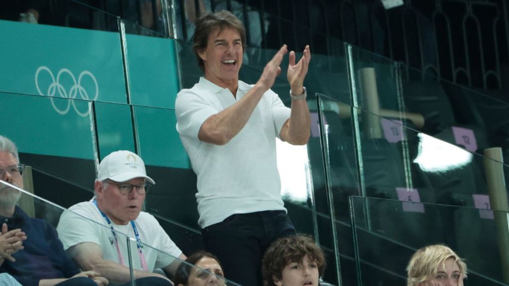 Tom Cruise attends day two of the Paris 2024 Olympic Games at the artistic gymnastics event with Simone Biles of USA at Paris Arena on July 28, 2024 in Paris, France.