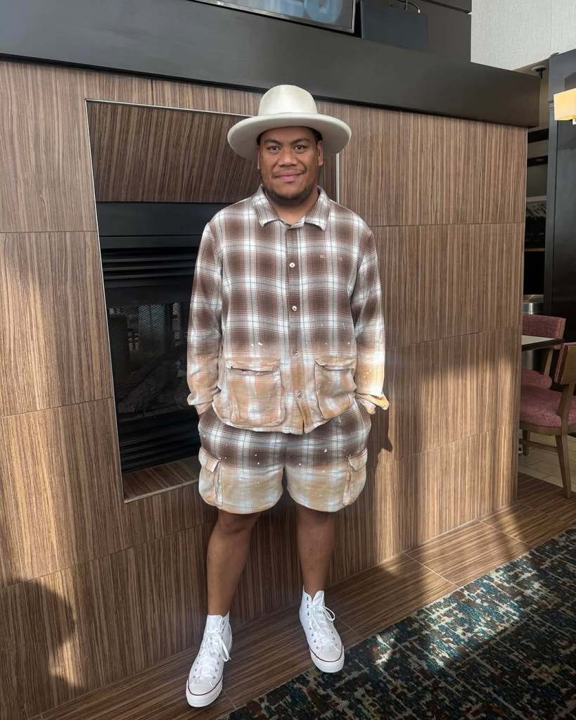 Afa Ah Loo from Project Runway wearing a brown plaid two-piece outfit 