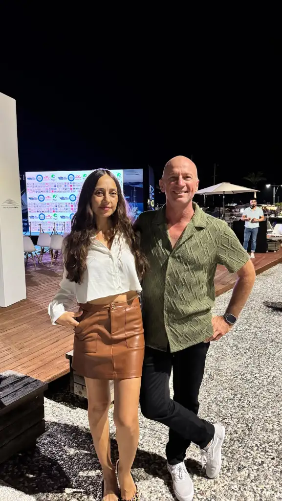 Captain Kerry Titheradge with his arm around his girlfriend