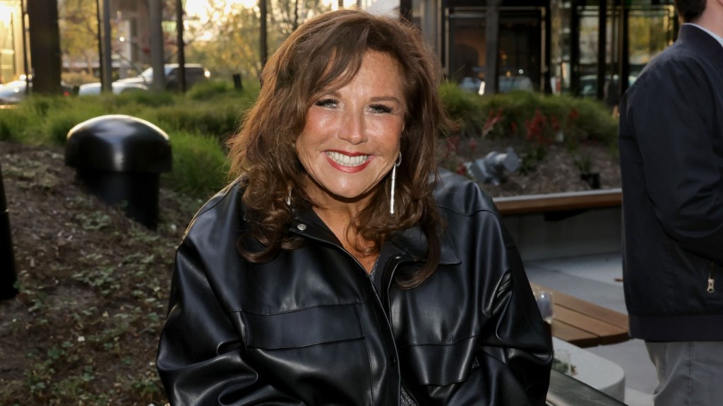 Abby Lee Miller in a black leather jacket