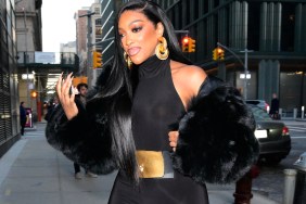 Porsha Williams in a black jumpsuit walking in New York City
