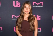 Gia Giudice from Next Gen NYC posing in a brown dress