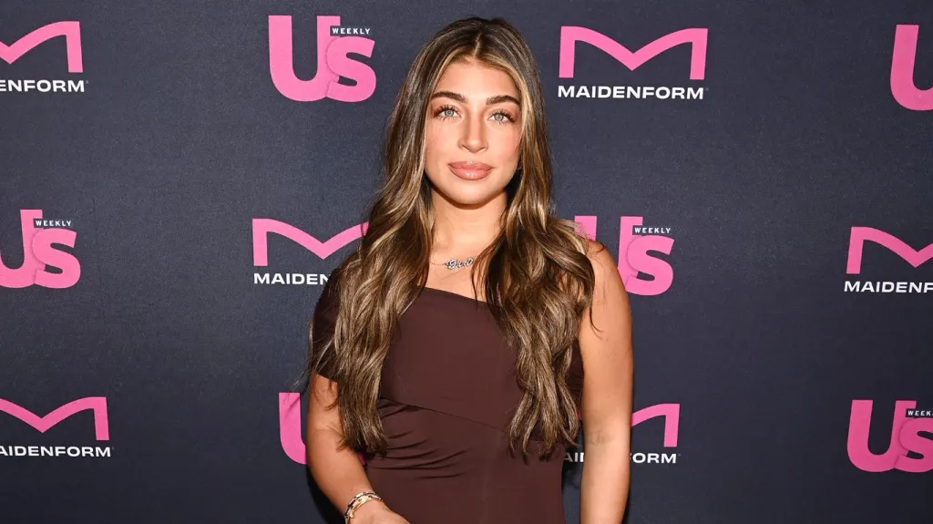 Gia Giudice from Next Gen NYC posing in a brown dress