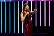 Vanessa Lachey in a red dress at Netflix's Tudum Live pointing at the camera