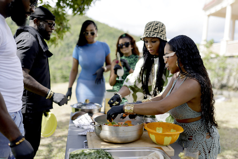 Kelli Ferrell, Brit Eady, and Angela Oakley cooking in Grenada on RHOA Season 16 Episode 14