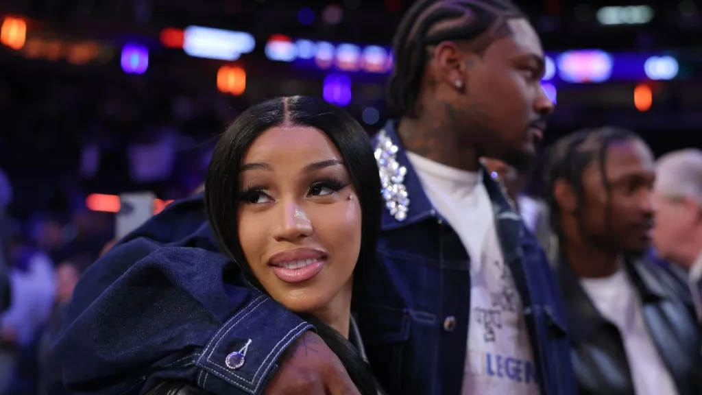 NFL Player Stefon Diggs (R) and rapper Cardi B (L) celebrate after Game Four of the Eastern Conference Second Round NBA Playoffs between the Boston Celtics and the New York Knicks at Madison Square Garden on May 12, 2025 in New York City.