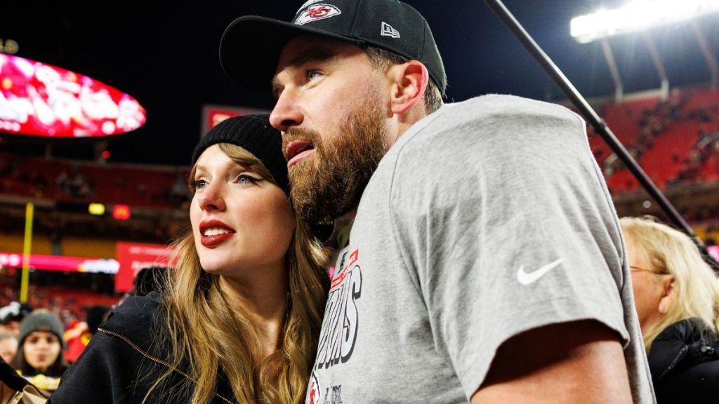 Tight end Travis Kelce #87 of the Kansas City Chiefs celebrates with Taylor Swift on the field after the AFC Championship game against the Buffalo Bills, at GEHA Field at Arrowhead Stadium on January 26, 2025 in Kansas City, Missouri.