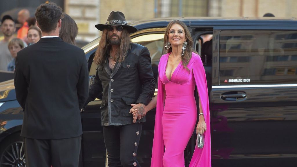 Billy Ray Cyrus and Elizabeth Hurley are seen arriving at the opening of the new Valentino Garavani space on May 24, 2025 in Rome, Italy.