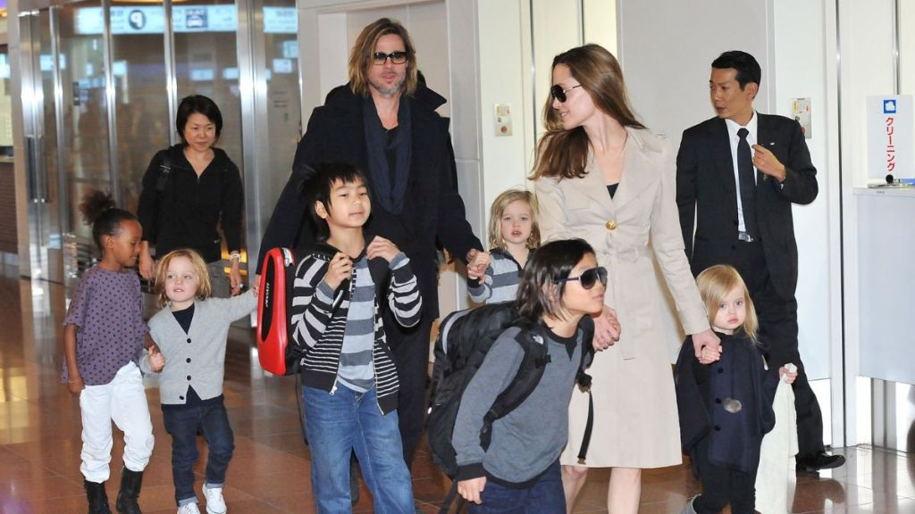 Brad Pitt, Angelina Jolie and their six children Maddox, Pax, Zahara, Shiloh, Knox, and Vivienne arrive at Haneda International Airport on November 8 in Tokyo, Japan