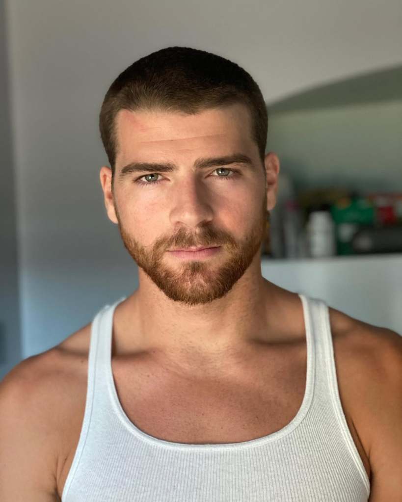 Cashel Barnett in a white tank top