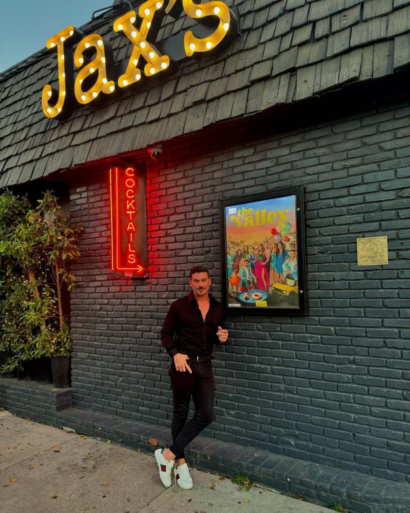 Jax Taylor posing in front of Jax's Studio City