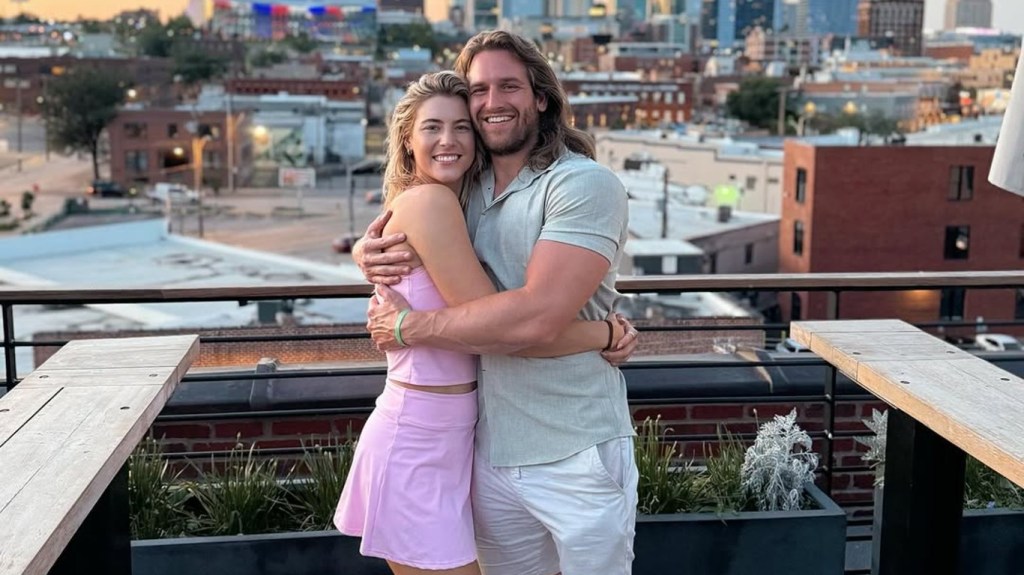 Joey and Sara from Love is Blind Season 8, hugging on a rooftop
