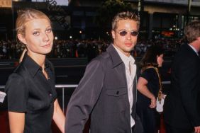American actress Gwyneth Paltrow, wearing a black short-sleeved outfit, and her partner, American actor Brad Pitt, who wears a dark grey jacket over a white shirt with sunglasses, attend the Hollywood premiere of 'Waterworld', at Mann's Chinese Theatre in the Hollywood neighbourhood of Los Angeles, California, 27th April 1995