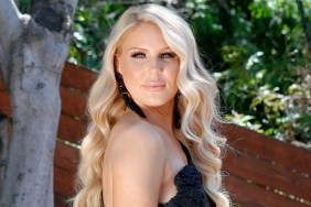 Gretchen Rossi posing outside in a black dress