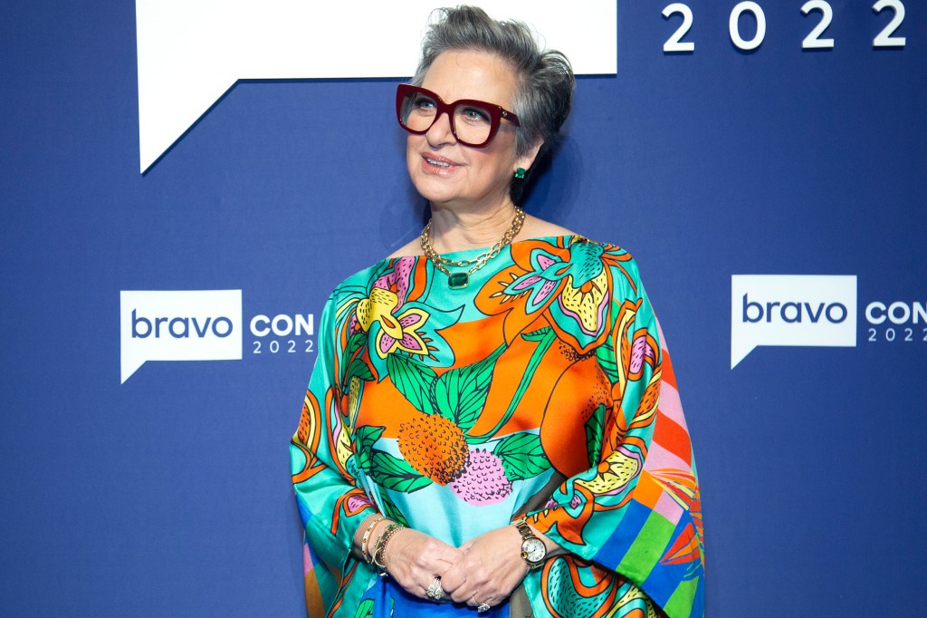 Caroline Manzo in a brightly colored floral dress at BravoCon 2022
