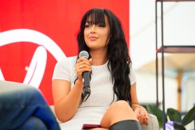 Sharon Gaffka on stage at Reading Festival, holding a microphone