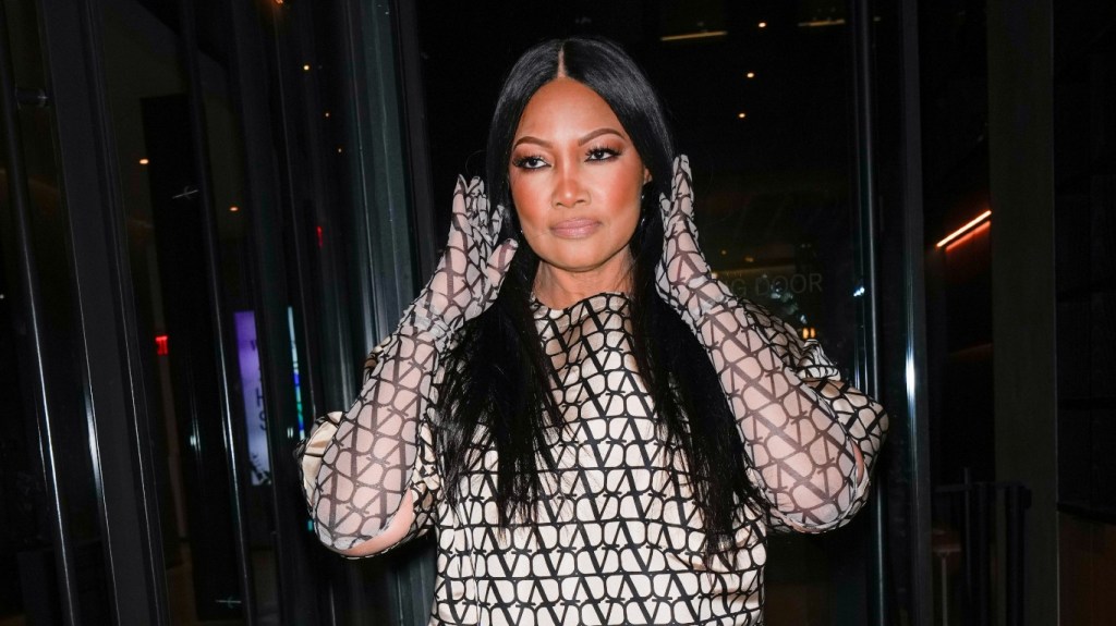 Garcelle Beauvais fixing her hair while leaving the Watch What Happens Live studios