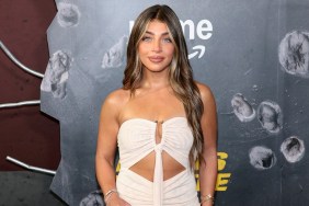 Gia Giudice in a white dress at a movie premiere