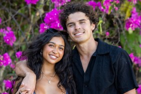 Cierra Ortega and Nicolas "Nic" Vansteenberghe from Love Island USA posing in front of purple flowers