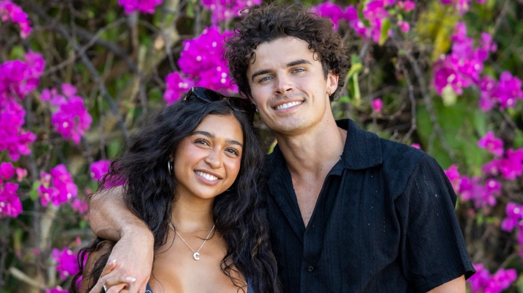 Cierra Ortega and Nicolas "Nic" Vansteenberghe from Love Island USA posing in front of purple flowers