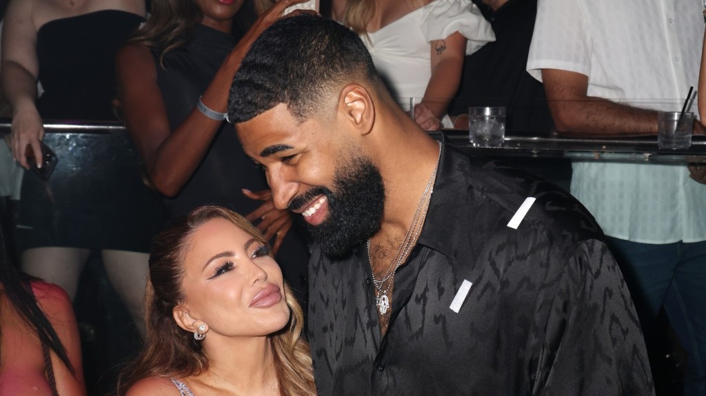 Larsa Pippen admiringly looking at Jeff Coby in the club