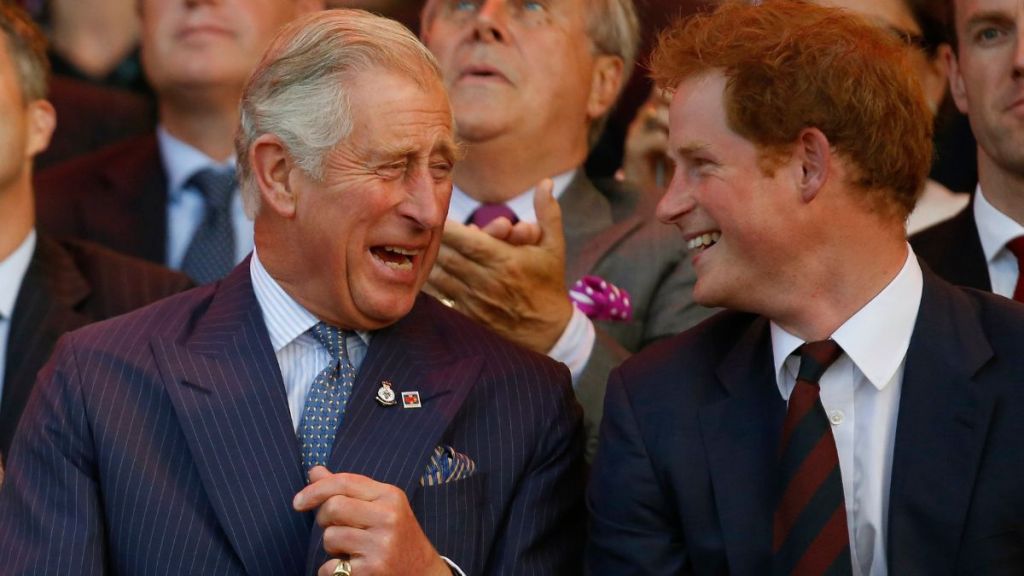 Prince Charles, Prince of Wales and Prince Harry (R) laugh during the opening ceremony of the Invictus Games at the Queen Elizabeth Park on September 10, 2014 in east London, England