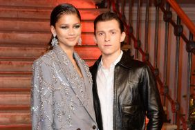 Zendaya and Tom Holland pose at a photocall for "Spider-Man: No Way Home" at The Old Sessions House on December 5, 2021 in London, England.