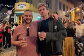 Omar Zaki and Charlie Zakkour posing together on a busy street