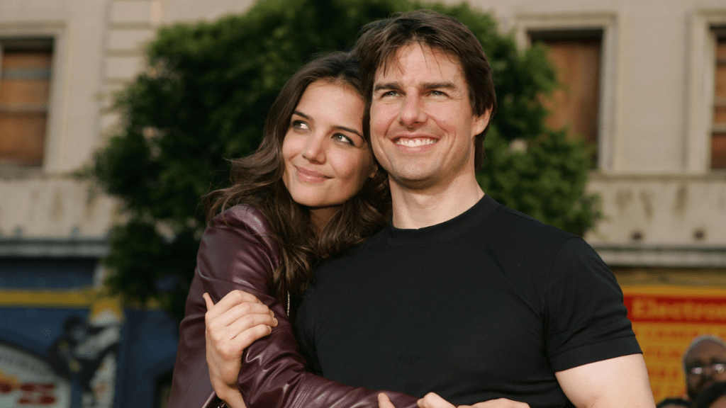 Actor Tom Cruise (R) and actress Katie Holmes arrive at the Los Angeles Fan Screening of "War of the Worlds" at the Grauman's Chinese Theatre on June 27, 2005 in Hollywood, California.