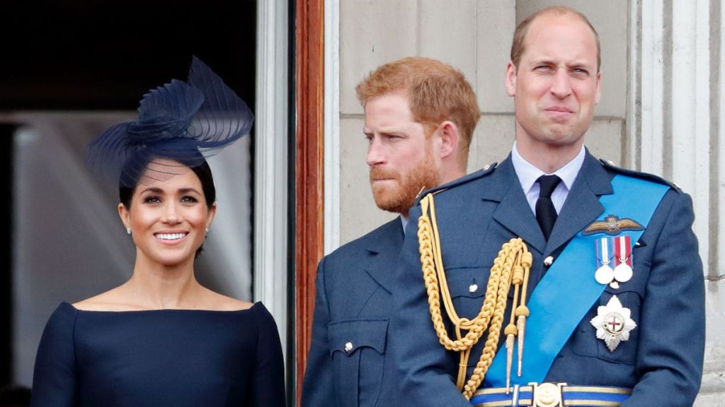 Meghan, Duchess of Sussex, Prince Harry, Duke of Sussex and Prince William, Duke of Cambridge watch a flypast to mark the centenary of the Royal Air Force from the balcony of Buckingham Palace on July 10, 2018 in London, England.