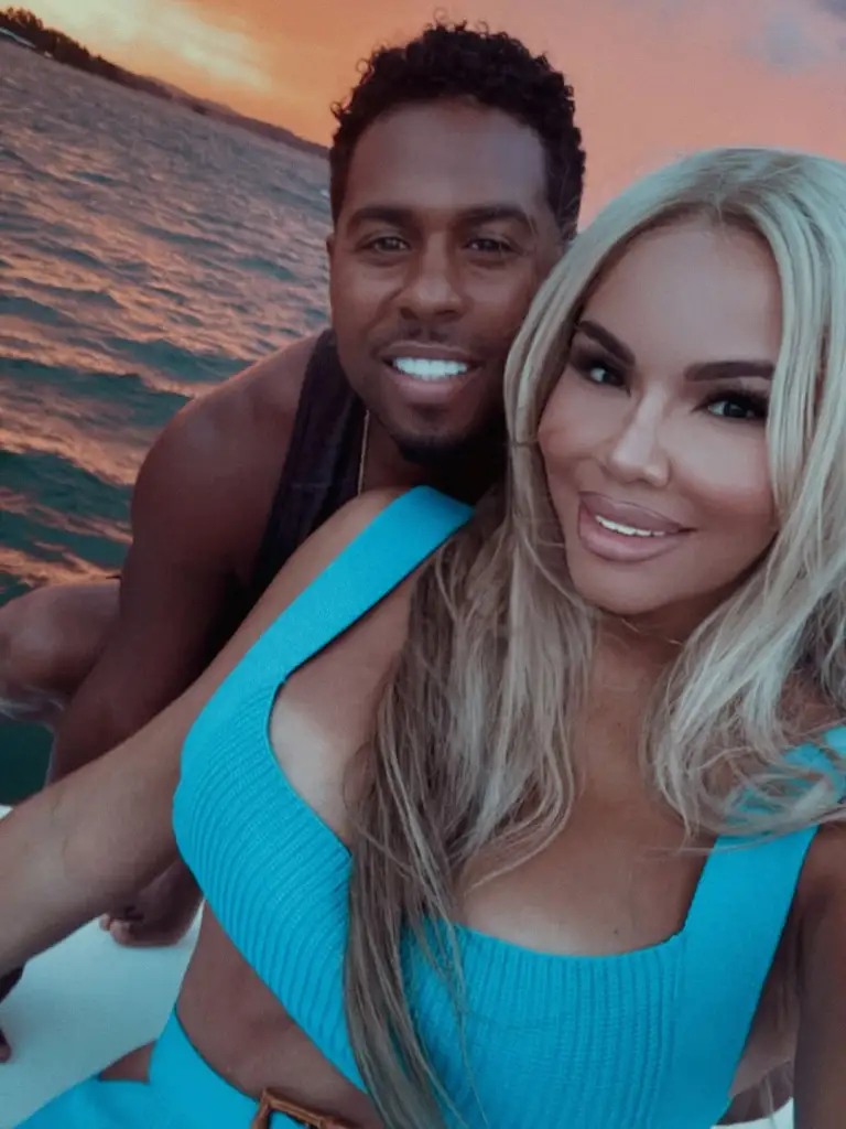 Mia Thornton posing on a boat with Bobby V