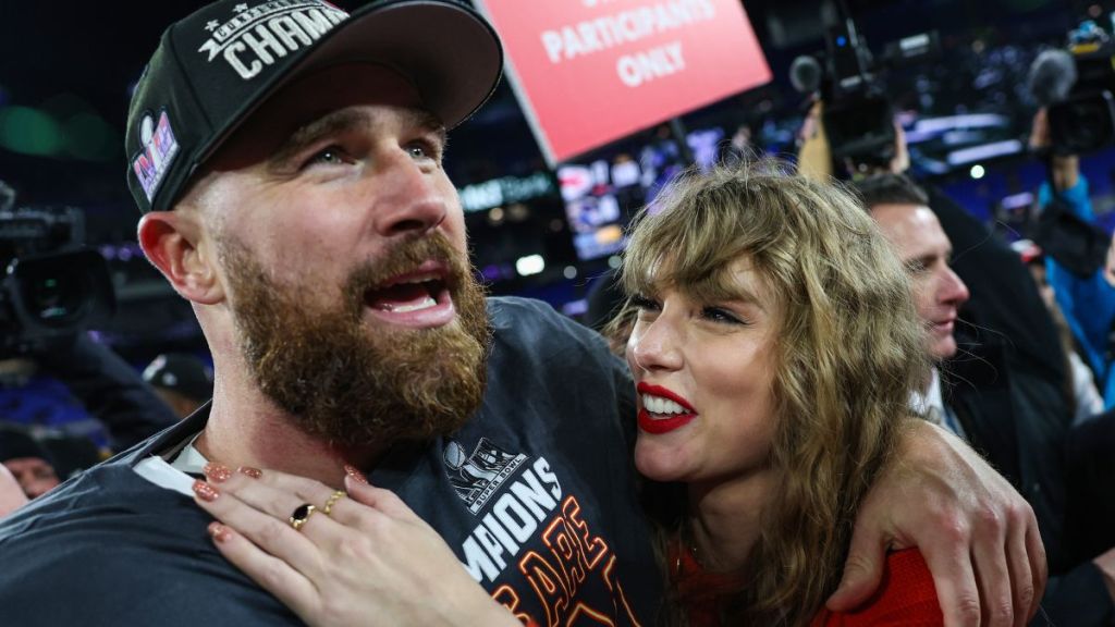 Travis Kelce #87 of the Kansas City Chiefs (L) celebrates with Taylor Swift after defeating the Baltimore Ravens in the AFC Championship Game at M&T Bank Stadium on January 28, 2024 in Baltimore, Maryland