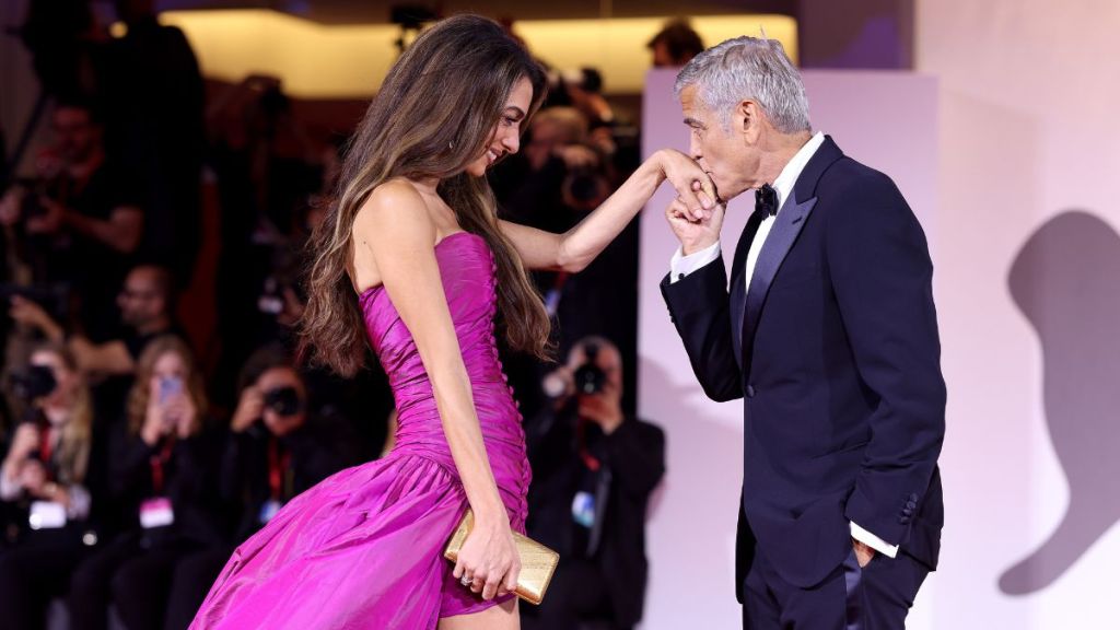 Amal Clooney and George Clooney attend the "Jay Kelly" red carpet during the 82nd Venice International Film Festival on August 28, 2025 in Venice, Italy.