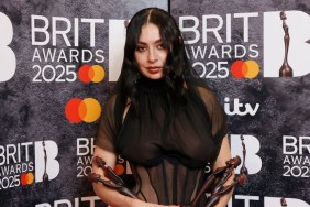 Charli XCX poses in the winners room with the awards for Artist of the Year, Song of the Year, Album of the Year and Dance Act during The BRIT Awards 2025 at The O2 Arena on March 01, 2025 in London, England