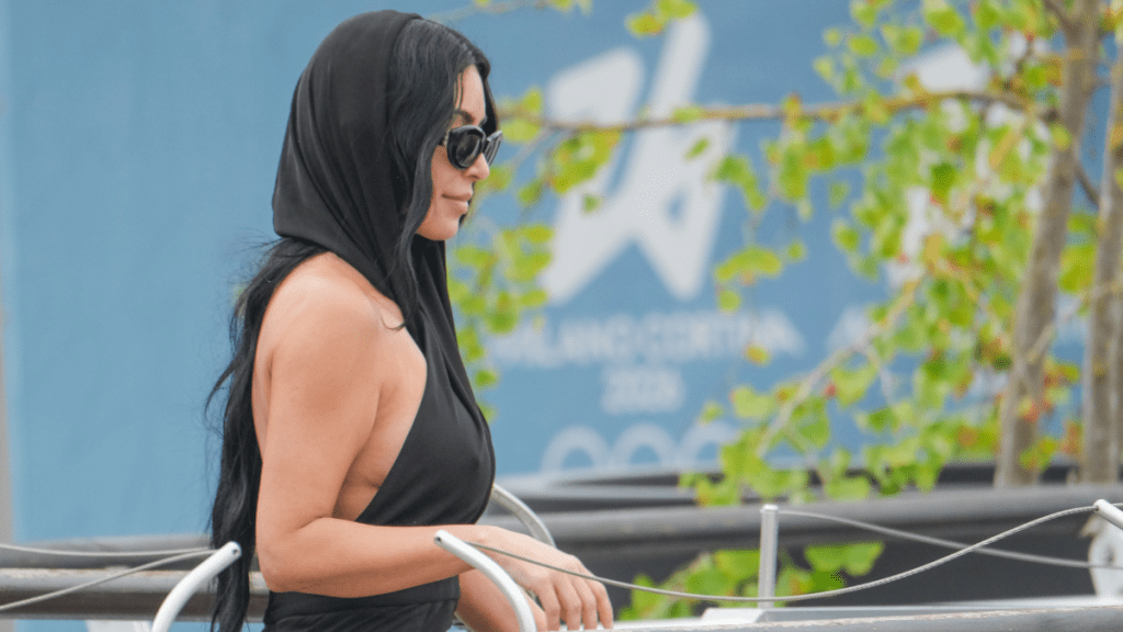 Kim Kardashian Goes Braless & Flaunts Her Curves in Gray Gown
