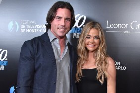Aaron Phypers in a blue blazer and Denise Richards in a black dress posing together at a red carpet