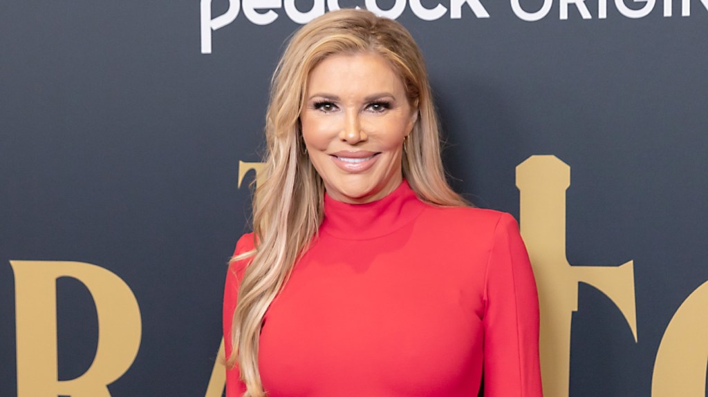 Brandi Glanville in a red dress at the premiere of The Traitors